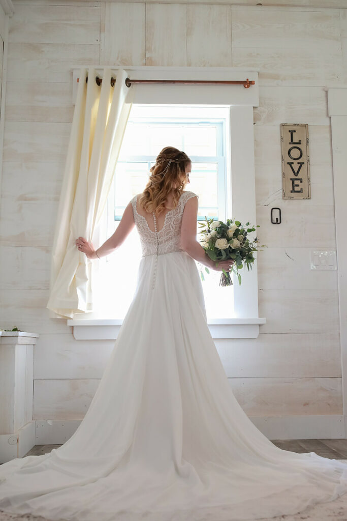 bride posing in honeymoon cottage