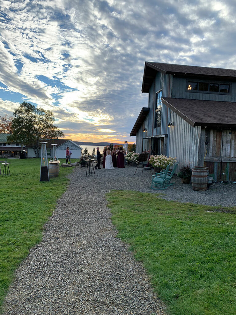 wedding guests outside barn